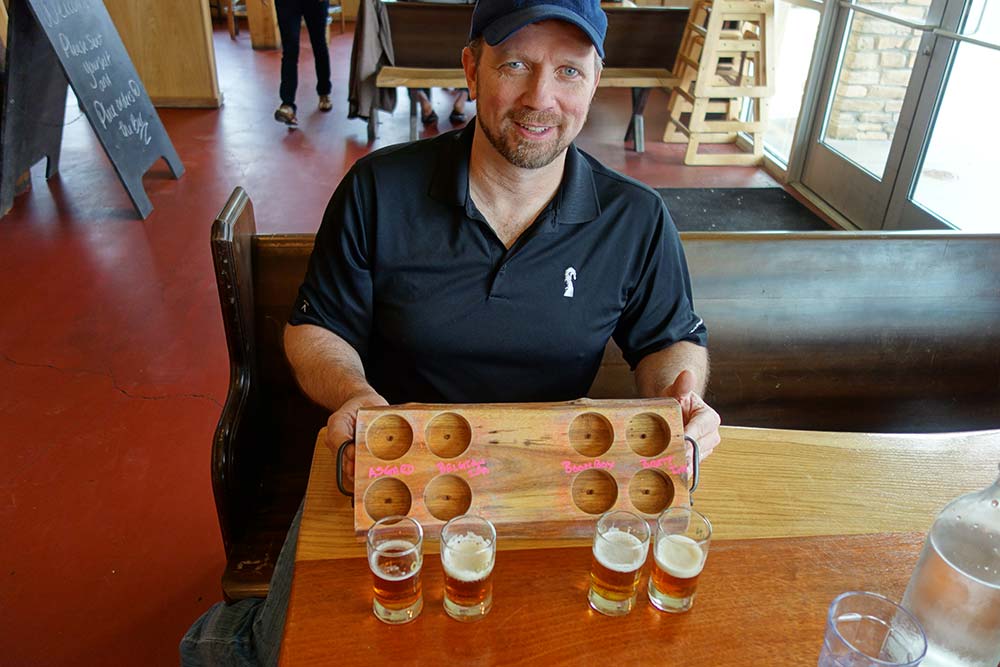 Brewer Wes Peterson shows off some of his beer.