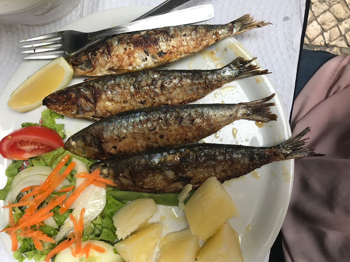 Food from Heaven - "Fresh sardines., grilled. Downtown Lisbon Portugal in August 2019” by Irene Holthaus