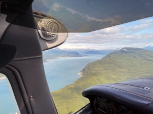 flying over snug harbor outpost in alaska